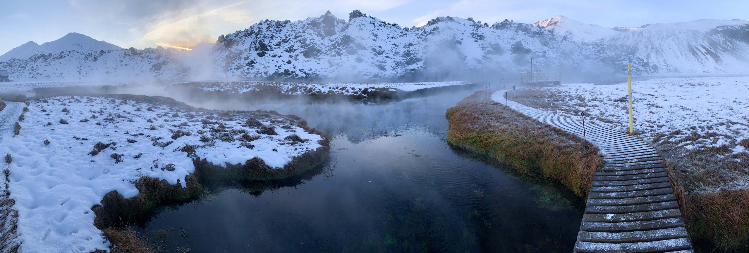 Travelers soaking in Landmannalaugar hot spring