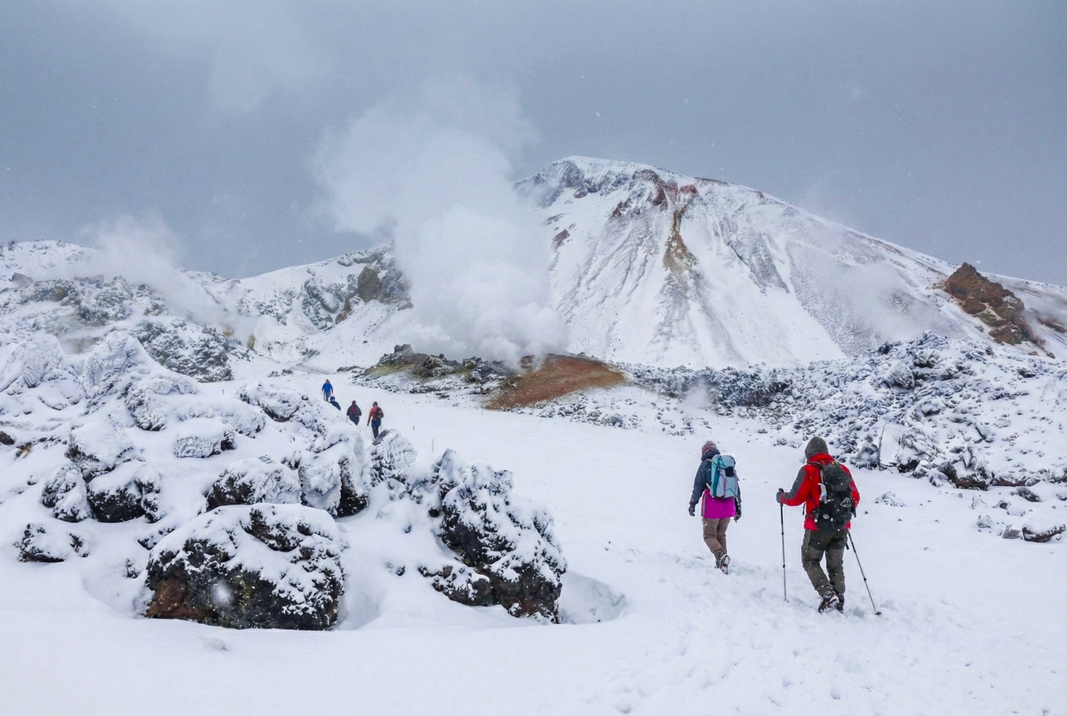 Travelers soaking in Landmannalaugar hot spring